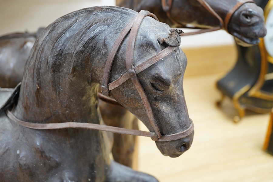 A pair of leather covered models of horses possibly Omersea for Liberty, 49cm. Condition - fair